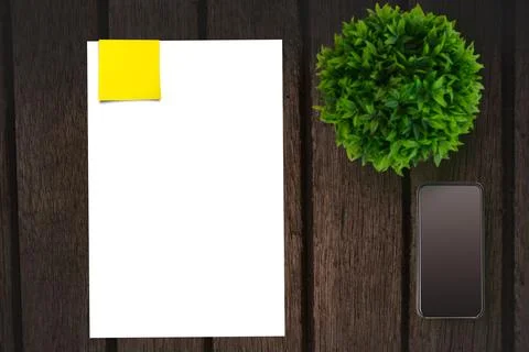 Table with a sheet of paper and a mobile phone Stock Illustration