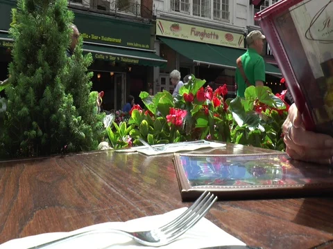 Table Shot with Menu and Passerbys 스톡 동영상 79074632