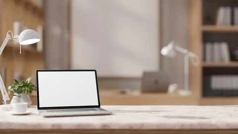 The table showcases a white-screen laptop computer in a contemporary office. Stock Illustration