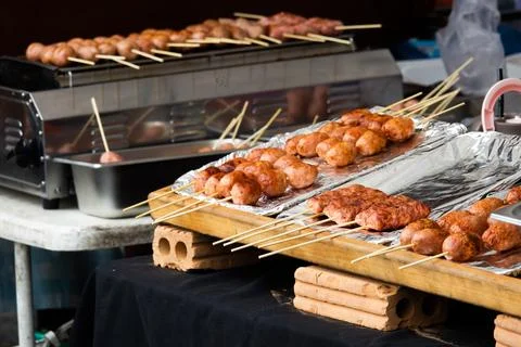 A table with skewers of meat on it Stock Photos