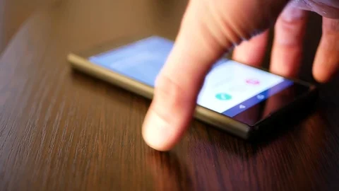 On the table the  smartphone in response to the signal. Stock Footage 104803892