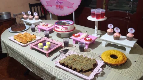 A table with snacks, cakes and cakes at a children's birthday party Stock Footage 155304606