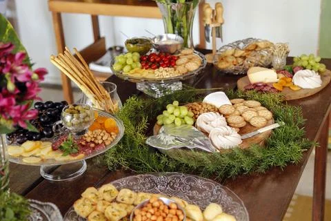 Table with snacks - party buffet with various savory foods Stock Photos