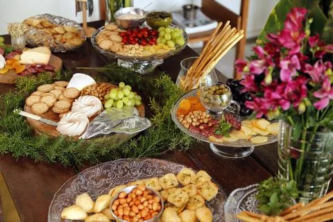 Table with snacks - party buffet with various savory foods Stock Photos