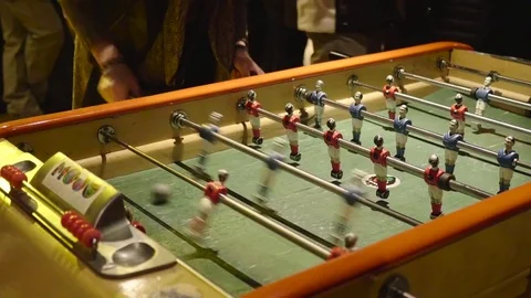 Table soccer game where players have fun in a club Stock Footage 71344455