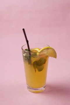 On the table, soft drinks, various cocktails, a glass with a straw and a slice Stock Photos
