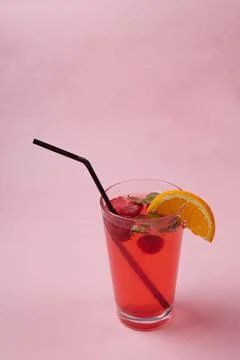 On the table, soft drinks, various cocktails, a glass with a straw and a slice Stock Photos