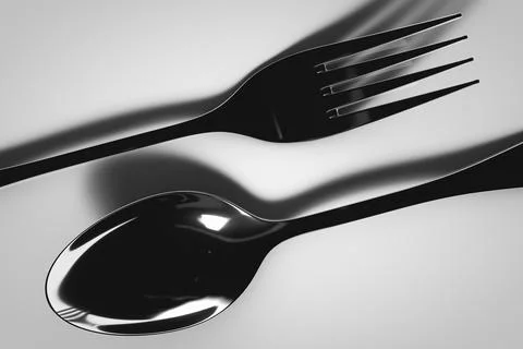 Table spoon and fork on the surface. Close-up Stock Photos