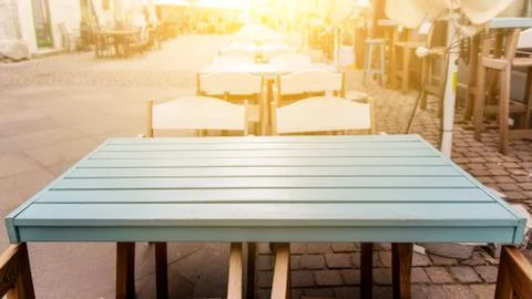 Table at summer terrace restaurant. Selective focus , vintage filter Stock Photos