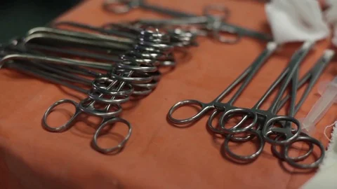 Table with surgical instruments. sterile. scalpels and clamps Video stock 70810130
