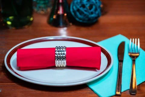Table with tableware at the bar is beautifully set with red candles Stock Photos
