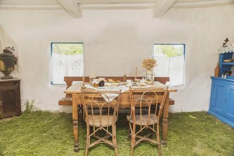 Table with tea and sweets in an old Ukrainian hut Stock Photos