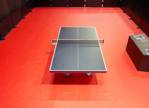 Table tennis black table with red floor from above. Indoor sports. Ping Pon.. Stock Photos