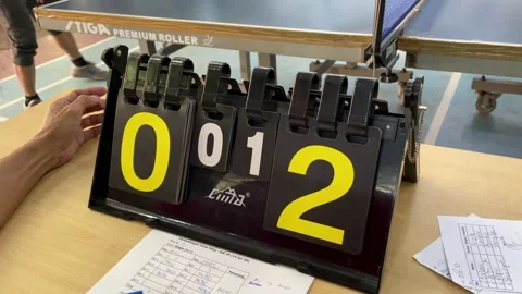 Table tennis judges' table with black scoreboard with yellow numbers Stock Footage 290884930