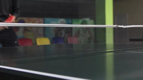 Table tennis net close-up. A man beats a tennis ball through the net. Stock Footage 145891354