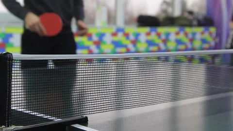 Table tennis net close-up. Two people play table tennis. Video stock 145891447
