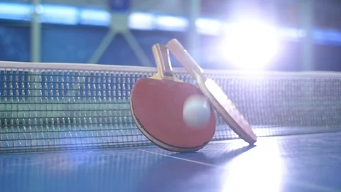 Table tennis paddles and jumping balls Stock Footage