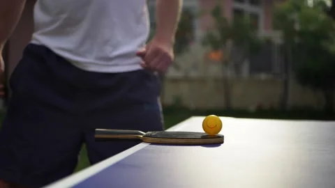 Table tennis player preparing for game. Excited man ping-pong player outdoors Stock Footage 130666071