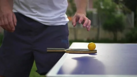 Table tennis player preparing for game. Man player touching ball and racket Stock Footage 130666150