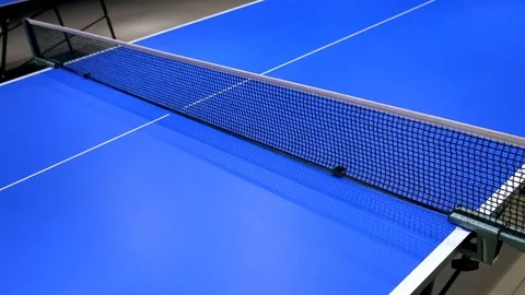 Table tennis player returning ball, focus at the net. Stock Footage 82723205