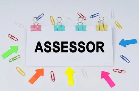On the table there are paper clips and directional arrows, a sign that says - Stock Photos