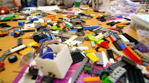 On the table there are scattered a lot of details from the children's designer Video stock 89233806