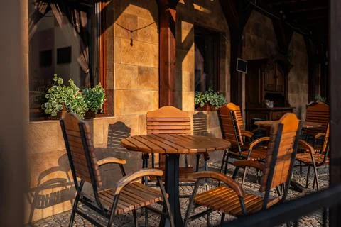 Table for three people in stylish restaurant and next to it Фото
