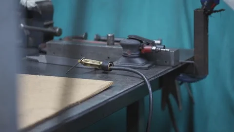 A table with tools and a piece of wood on it Video stock 302456934