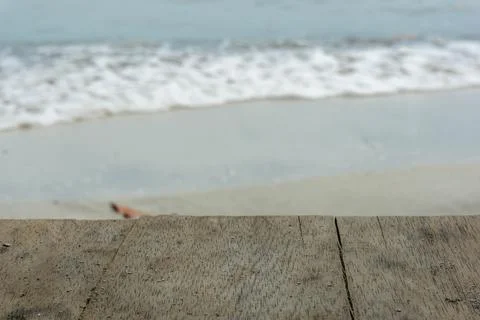 Table top with blurred background of foam waves on the beach Stock Photos