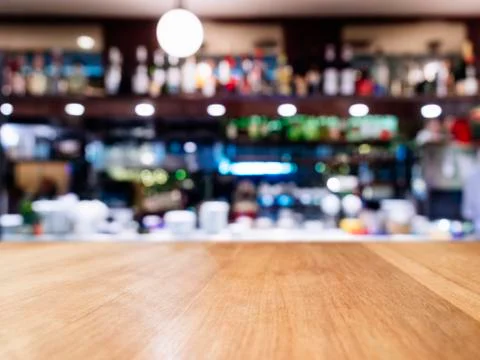 Table Top with Blurred Bar Shelf Restaurant Cafe Interior Background Stock Photos