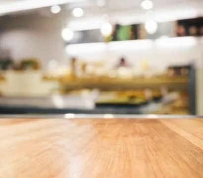 Table Top with Blurred Kitchen Interior Background Stock Photos