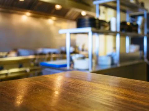 Table top counter with Blurred Kitchen Interior background Stock Photos
