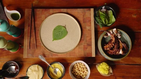 Table top down view of professional fine dinning chef plating delicious Stock Footage 165578151