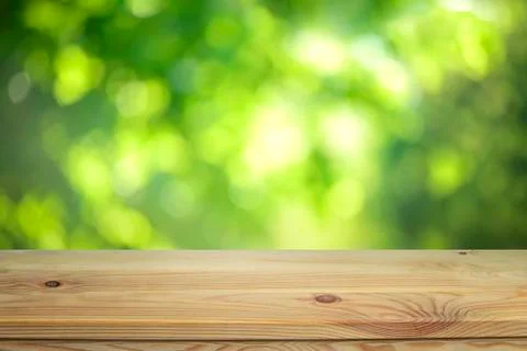 Table top infront of green blurred background Stock Photos