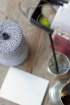 A table top with a small group of objects. tankard and pencils, paper and a l 写真素材