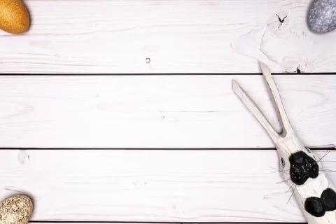 Table top with subtly colored Easter eggs and wooden Easter bunny Stock Photos