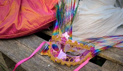 Table top view aerial image of beautiful pink carnival mask background.Access Stock Photos
