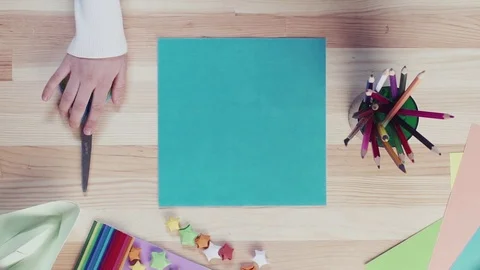 Table top view, the girl puts scissors Stock Footage 71626564