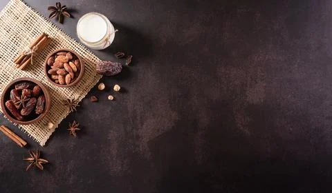 Table top view image of decoration Ramadan Kareem, dates fruit, milk and almo Stock Photos