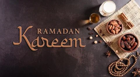 Table top view image of decoration Ramadan Kareem, dates fruit, milk and almo Foto stock