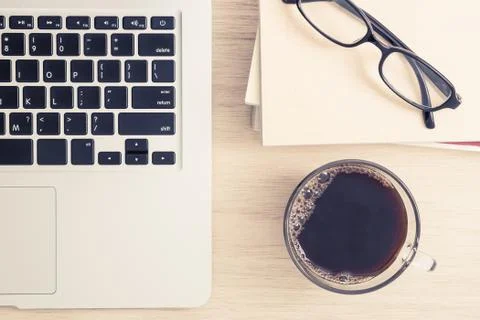 Table top view of office desk with laptop and coffee Stock Photos