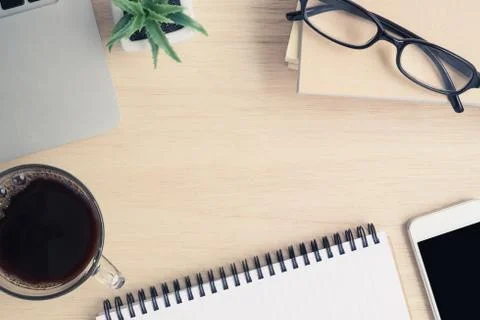 Table top view of office desk on wooden desk Stock Photos