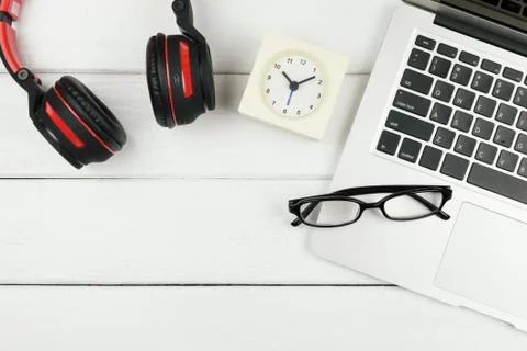 Table top view of office desk with laptop and headphone Stock Photos