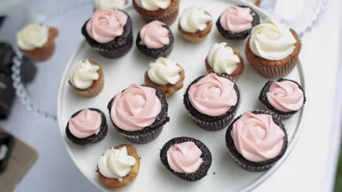 A table topped with lots of chocolate cake on a plate Stock Footage 155451047