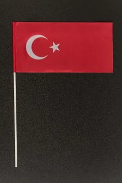 Table Turkish flag on a black background. Vertical frame Stock-Fotos