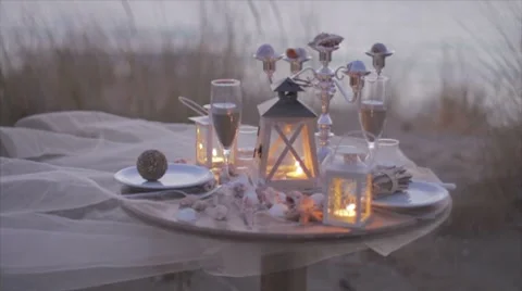 Table for two on the beach with candle light Stock Footage 7749493