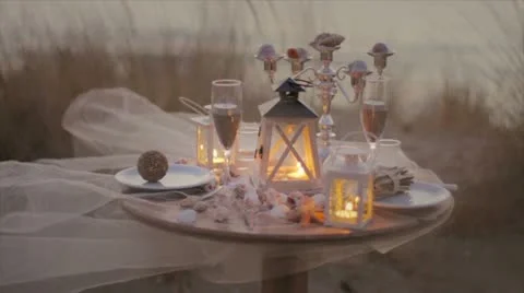 Table for two on the beach with candle light Stock Footage 10847356