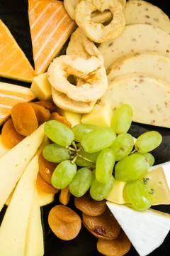 Table with variety of cheeses Stock Photos