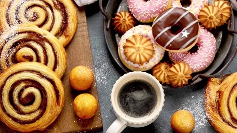 Table with various cookies, donuts, cakes Stock Footage 201907614