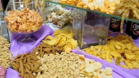 Table with various cookies, tarts, cakes, cupcakes and cakepops.  Buffet table Stock Footage 106450133